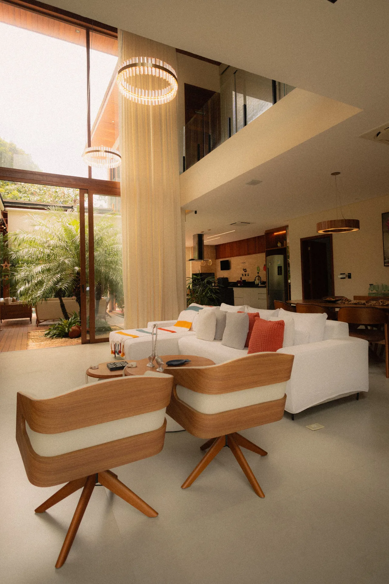 Sunlit contemporary living room with floor-to-ceiling windows